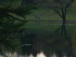 camera pan to two dancers dancing in distance Stock Footage