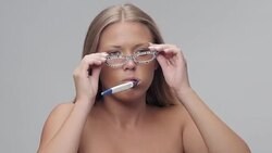 Young Beautiful Woman Brushing Teeth. People Waking Up. Part of Series. Stock Footage