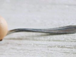 CU PAN Shot of egg in spoon / London, United Kingdom  Stock Footage