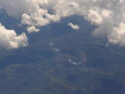 Flyover Mountains and Clouds Stock Footage
