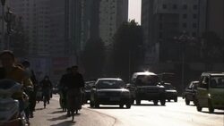 Traffic flows on a busy Tibetan street. Stock Footage