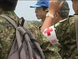 WRAP Aid workers on clean-up, US aid plane; Japan medical team News Clip