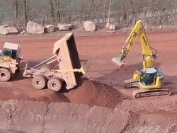 MS Crane collecting mu from  quarry / Taben-Rodt, Hesse, Germany Stock Footage