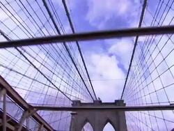 The arches of one of the Brooklyn Bridge towers frame a cloudy sky in New York City. Stock Footage