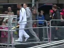 Lewis Hamilton is the first torch relay runner as Stock Footage