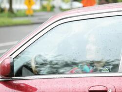 MS TU TS Two women with umbrellas emerging from car / Portland, Oregon, USA Stock Footage