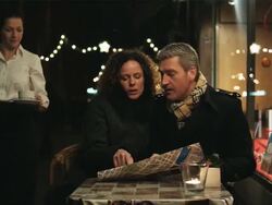 MS Couple looking at tourist map and being served coffee at outdoor cafe / Copenhagen, Denmark Stock Footage