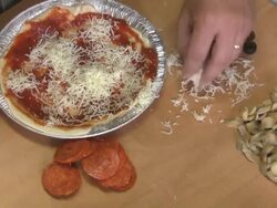 making a small pizza Stock Footage