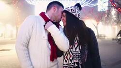 Mid 20's couple enjoying a walk on winter night. Stock Footage