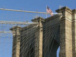 MS View of American Flag on top of Brooklyn Bridge / New York City, New York, USA Stock Footage