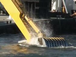(HD1080i) Dredging Sediment Mud From Under Water, Scoop Goes In Stock Footage