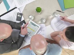 HD CRANE: Explaining Financial Plan While Using A Tablet Computer Stock Footage