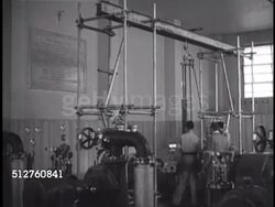 1940: VATICAN CITY MAINTENANCE: INT Small power plant, men w/ hoist chain standing near generator, MS Pius XI plaque on wall. Instructional Video