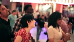 Friends cheer and sing along at outdoor concert in downtown Las Vegas Stock Footage