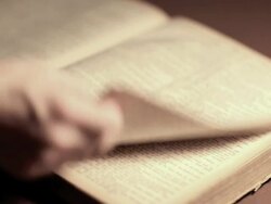 Searching Through a Vintage Bible (HD,NTSC) Stock Footage