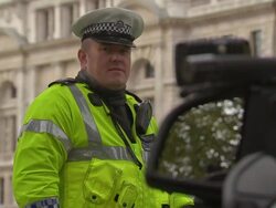 Police and police cars on Remembrance Day News Clip