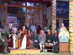 WS Dalai Lama placing   katag around neck of  attendant at his 70th birthday party AUDIO / Dharmasala, Himachal Pradesh, India Stock Footage