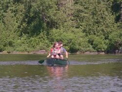 WS TS View of Couple canoeing on Long Pond / Maine, United States Stock Footage