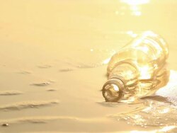 Bottle on the beach Stock Footage