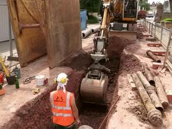 MS Shot of workmen Engraving on street for works at sewage pipe / Saarburg, Rhineland Palatinate, Germany Stock Footage