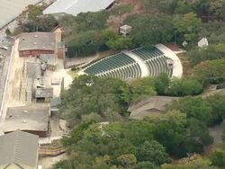 MS AERIAL Shot of Empty auditorium and fort raleigh and roanoke Gardens with lake / North Carolina, United States Stock Footage