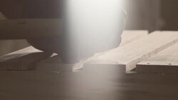 Carpenter hammering nail Stock Footage