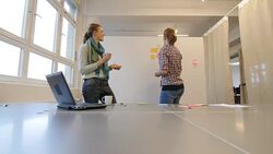 Female professionals writing on adhesive notes Stock Footage