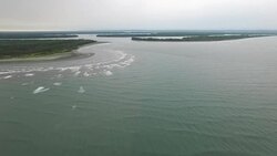 Ocean entrance to the Murik Lakes estuary from above Stock Footage