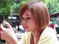 Two young women using a digital tablet at the tourist spot in Shanghai Stock Footage