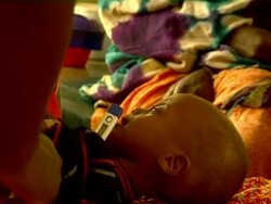 Woman taking the temperature from sick child Stock Footage