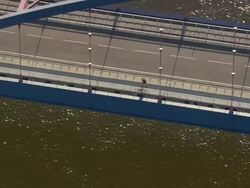MS AERIAL ZO Shot of man walking and cars passing through new bridge on Elbe river / Germany Stock Footage