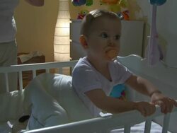 HD CRANE: Baby Awakening At Night Stock Footage