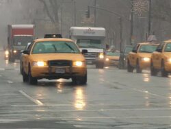 WS View of Traffic at Central Park West during snow / New York City, New York, USA Stock Footage