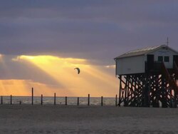 MS View of cafÃƒÂ© and beach during sunset, North Sea North Frisia, / St. Peter Ording, Schleswig Holstein, Germany Stock Footage