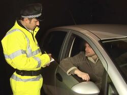Policeman gives speeding ticket Stock Footage
