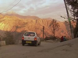 WS PAN View of vehicles and donkey moving on road  / Dharamsala, Himachal Pradesh, India Stock Footage