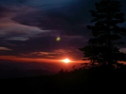 T/L sun rising over valley in the Shiga Kogen mountains, Japan Stock Footage
