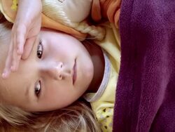 Little girl lying sick in her bed Stock Footage