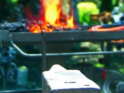 Blacksmith Forges a Horseshoe Stock Footage