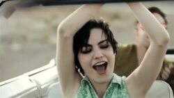 Friends on road trip in classic convertible dance and sing along with the radio Stock Footage