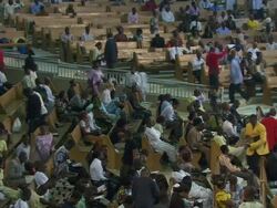 MS Large church interior filling up with people praying, singing and dancing / Lagos, Nigeria Stock Footage