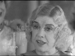 1920s: NEW YORK CITY: SPEAKEASY: Broadway speakeasy proprietor & entertainer Texas Guinan (1884-1933) standing w/ lightly dressed females, SOT saying '...many a sucker has cut himself too big a piece of cake...'   Prohibition, 18th Amendment. Instructional Video