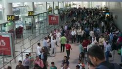 POV of a passenger coming down the escalators to the departures gates at the Indira Gandhi International Airport, Delhi Stock Footage
