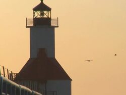 Lighthouse with Seagulls and Surf at Sunset Part 1 Stock Footage