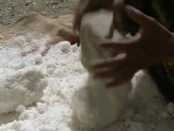CU Measuring tibetan salt to be packed / Saldang village, High Himalayas, Upper Dolpo near Tibetan border, Nepal  Stock Footage