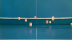 Ping-Pong balls falling on tennis table Stock Footage