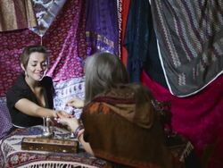 Gypsy Reads Palm of Young Woman Stock Footage