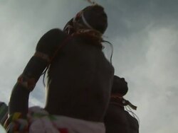 Maasai Ceremony - Warriors jumping up and down, dancing, low angle close up Stock Footage