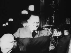 Kansas City store owner distributes coats to unemployed men during the Great Depression Stock Footage