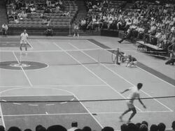 Fred Stolle vs Roy Emerson in tennis match Stock Footage